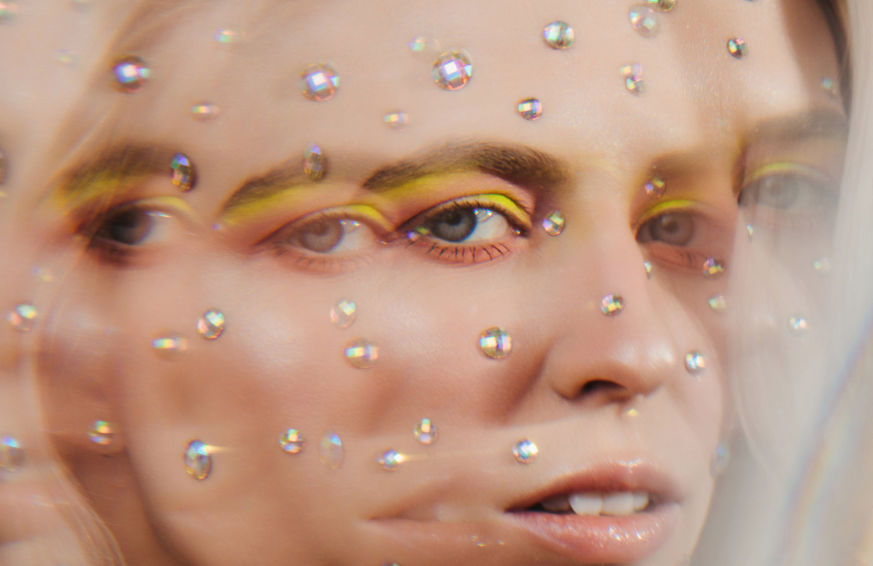 Woman with diamonds on her face to indicate acne positivity