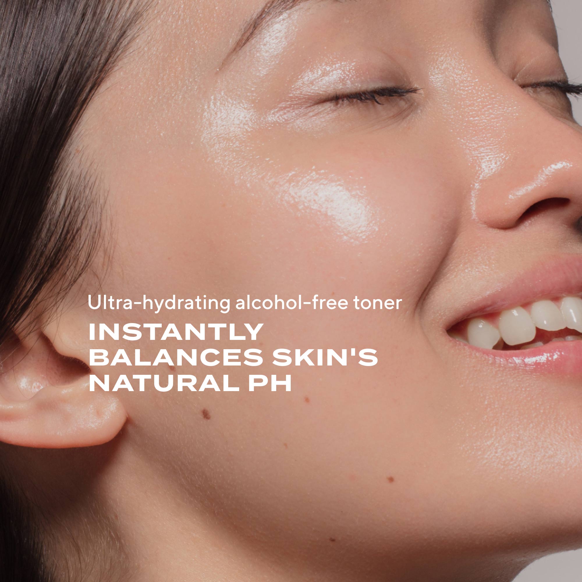Close-up of person's face with dewy, moisturized skin and glossy complexion.