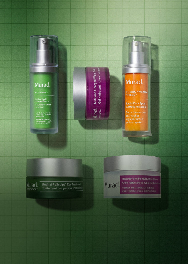Five Murad skincare products arranged on a green grid background: two pump bottles, one jar, and two cream jars. Visible products include the Environment Elixir, The Treatment, Refining Serums, and Resurfacing Hydrating Cleanser.