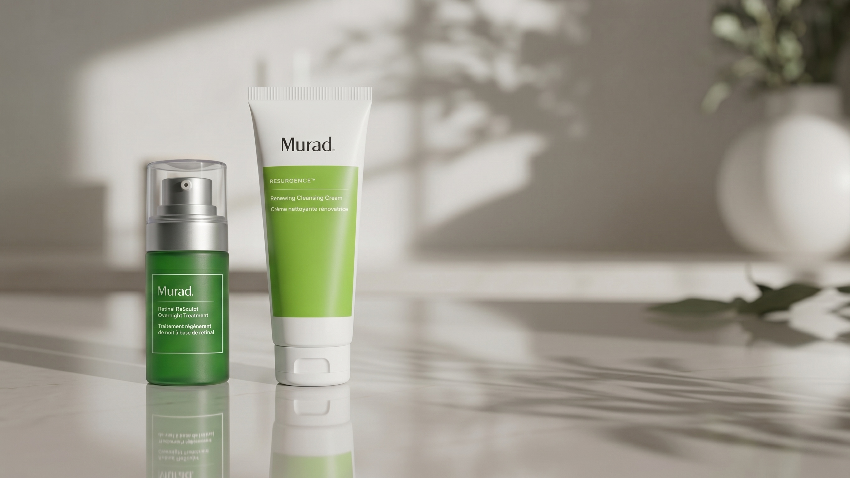 Two Murad skincare products on a neutral background